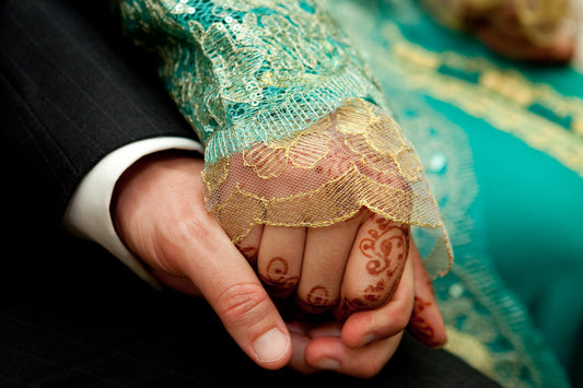 Hands of a Moroccan bride and groom at their wedding