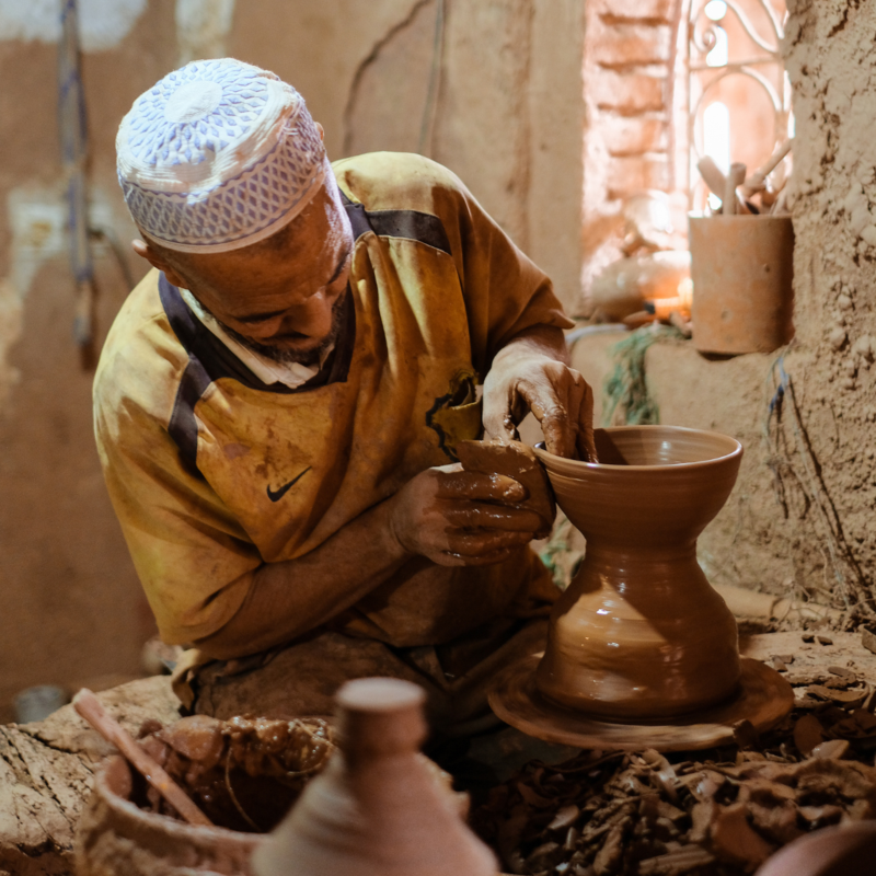 Moroccan man creating pottery
