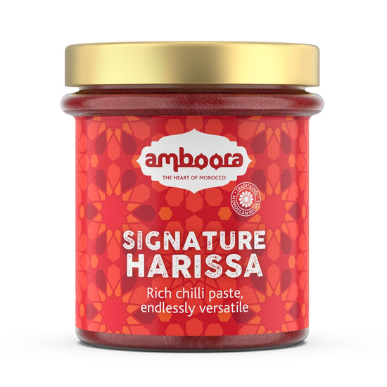 Amboora signature harissa in a jar with natural ingredients like fresh chillis, spices and herbs