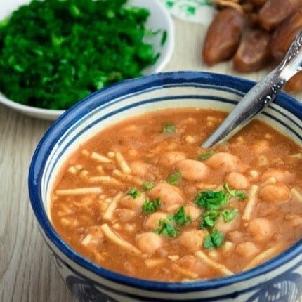 Amboora Moroccan warm ras el hanout spice cooked in harira, a Moroccan chickpea soup