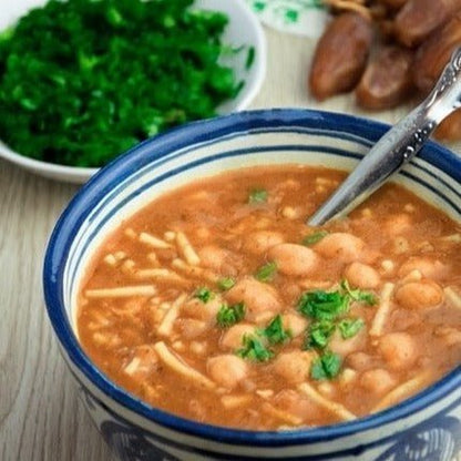 Amboora Moroccan warm ras el hanout spice cooked in harira, a Moroccan chickpea soup